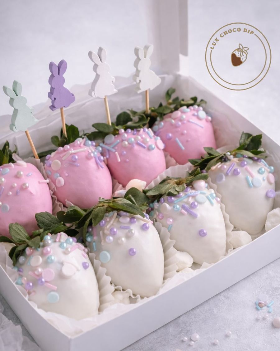 Pink and white chocolate-dipped strawberries in a gift box