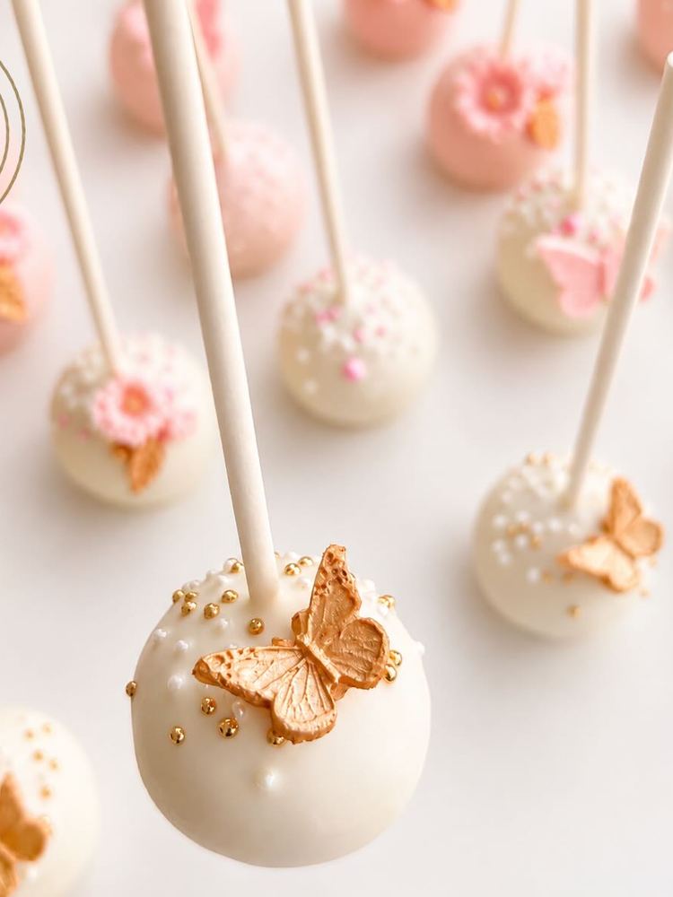 White and pink cake pops with gold butterflies