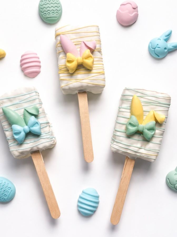 Easter cakesicles with pastel bows and bunny details